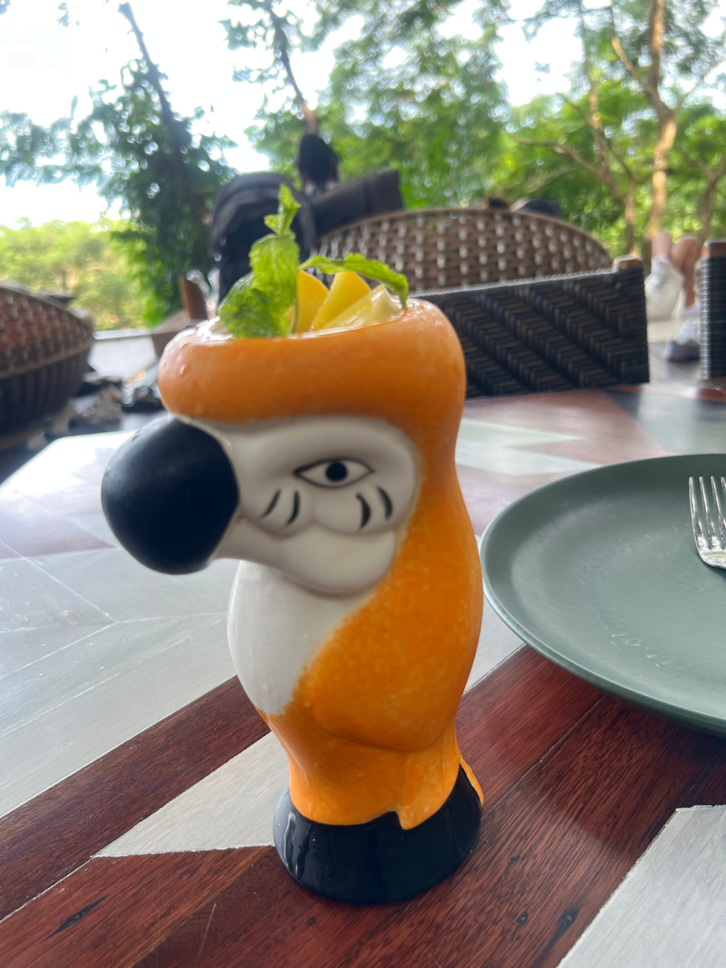 A tropical cocktail served in a toucan-shaped glass at Three Monkeys Restaurant in Phuket