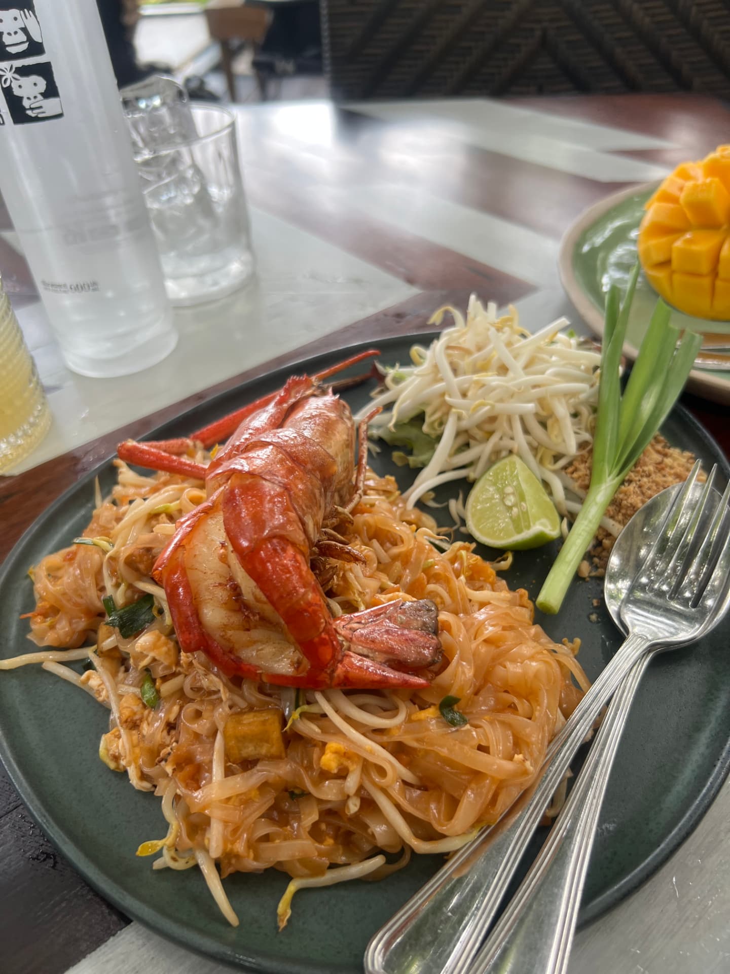 Pad Thai with a prawn on a green plate in Phuket