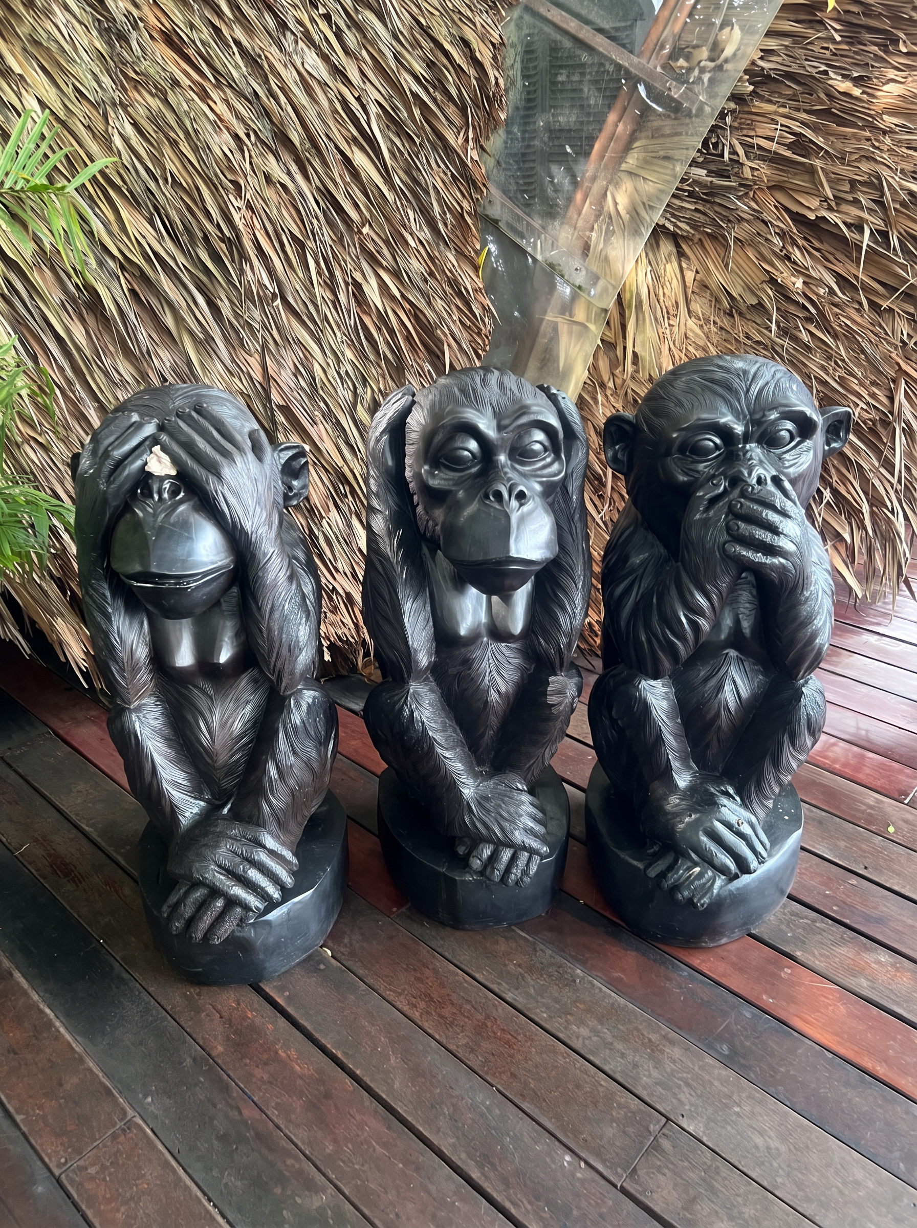 See no evil, hear no evil, speak no evil monkey statues at Three Monkeys Restaurant in Phuket