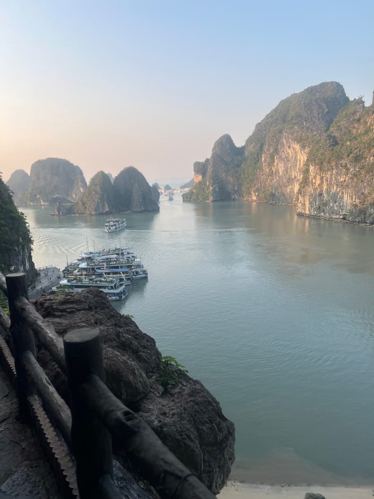 Golden light over the water and karsts of Ha Long Bay