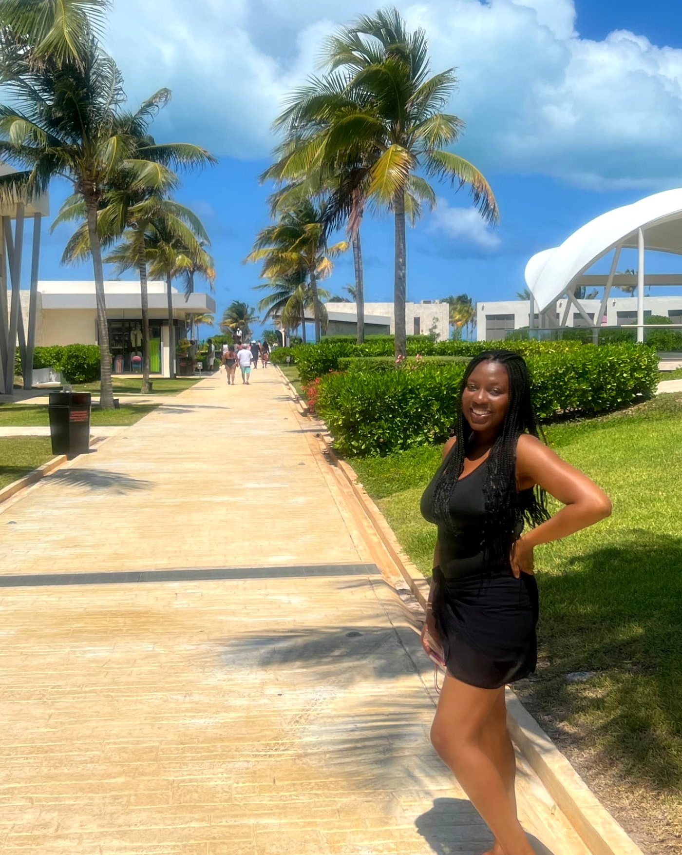 Walking the palm-lined path through the resort in Cancun