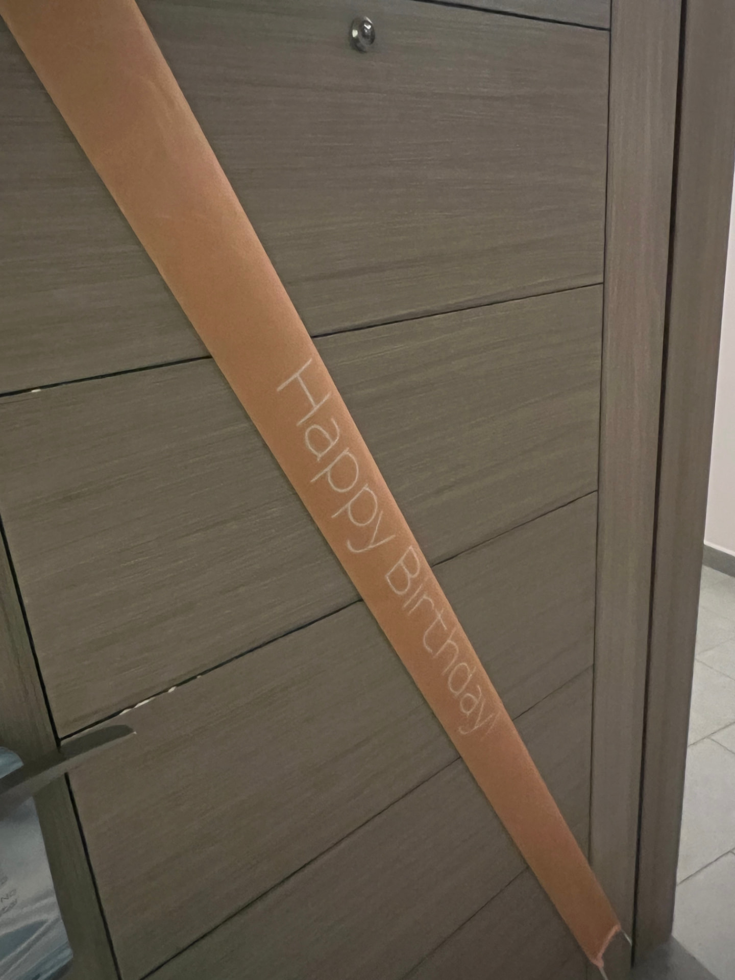 A Happy Birthday ribbon banner across the door of my room at Royalton CHIC Antigua