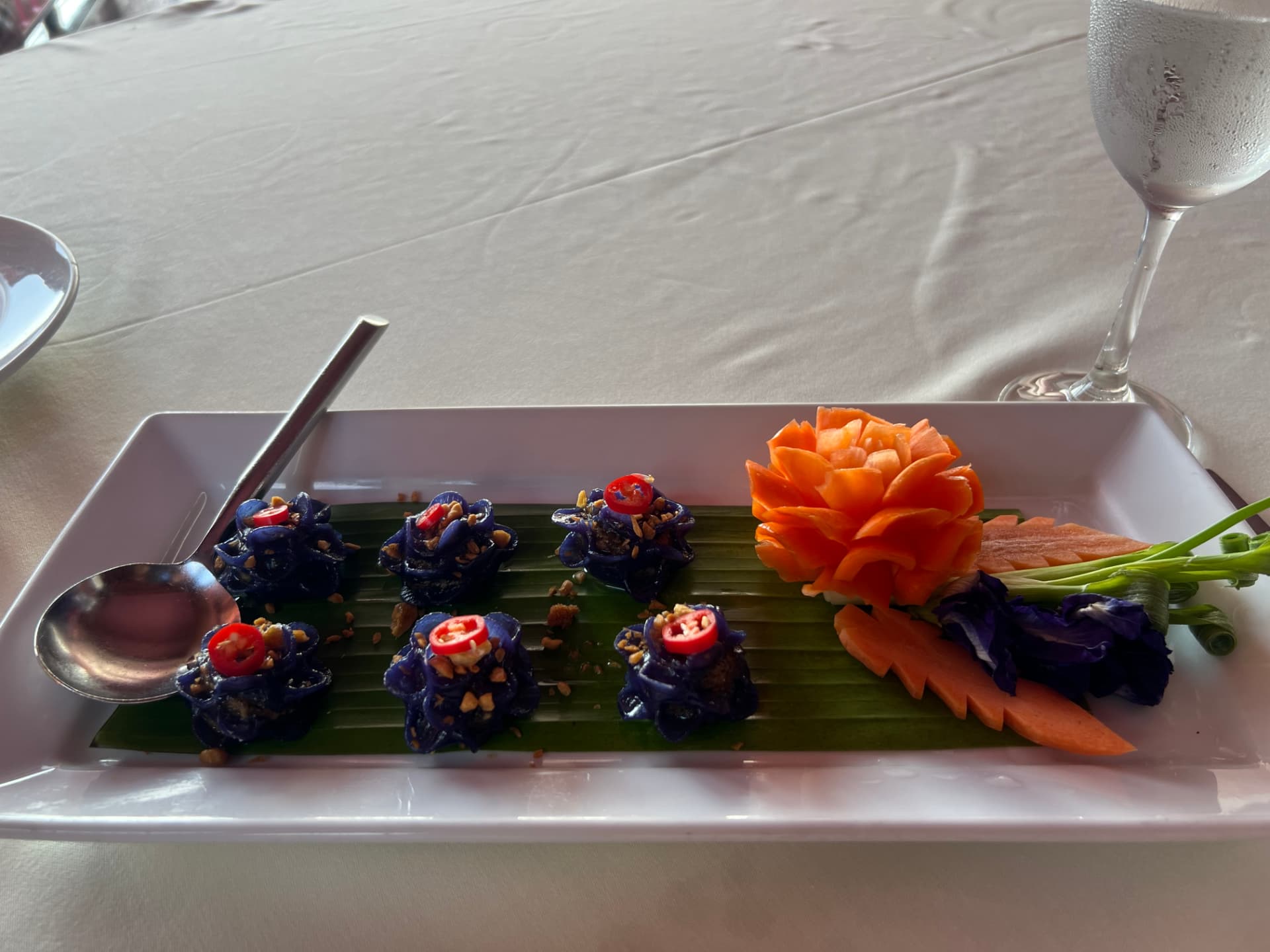 Butterfly pea flower dumpling appetizer at Baan Rim Pa in Phuket