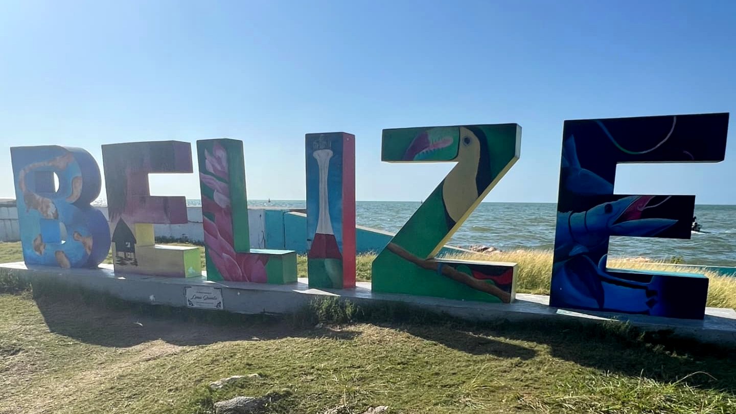 Colourful Belize sign by the Caribbean Sea